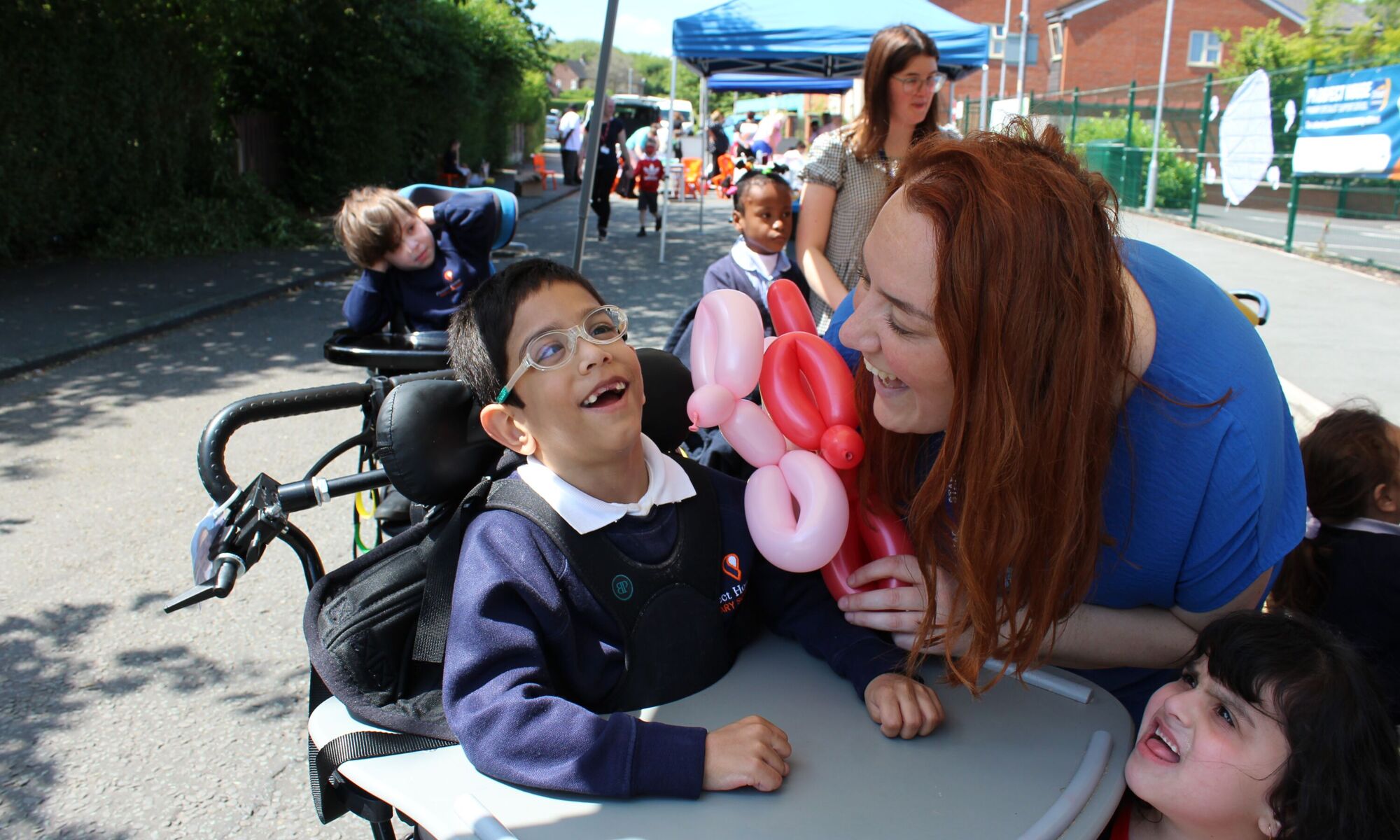 Prospere Learning Trust Teacher and a student outside, smiling at each other